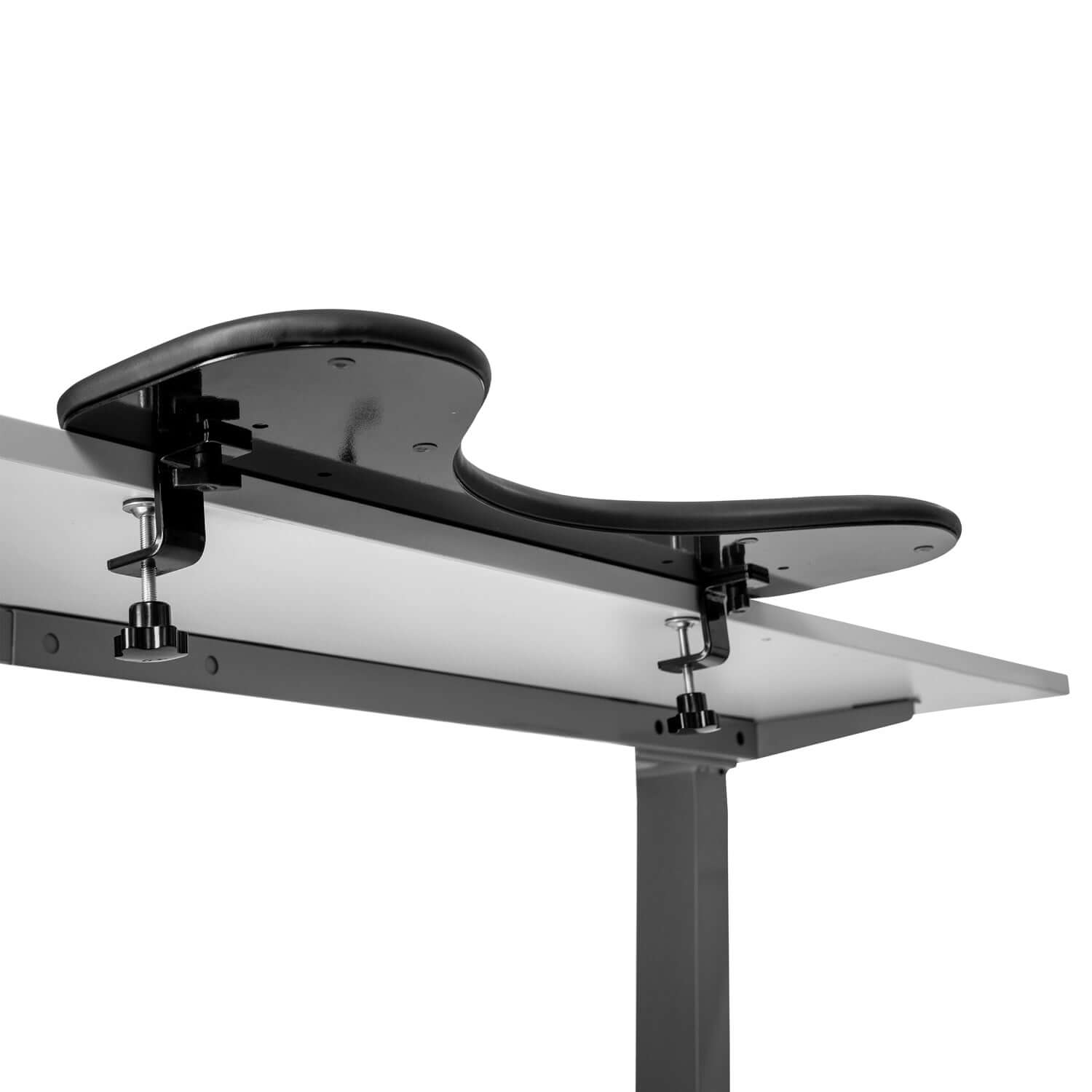 Ergonomic arm support in black artificial leather, mounted on table edge for pain relief in shoulders and neck.