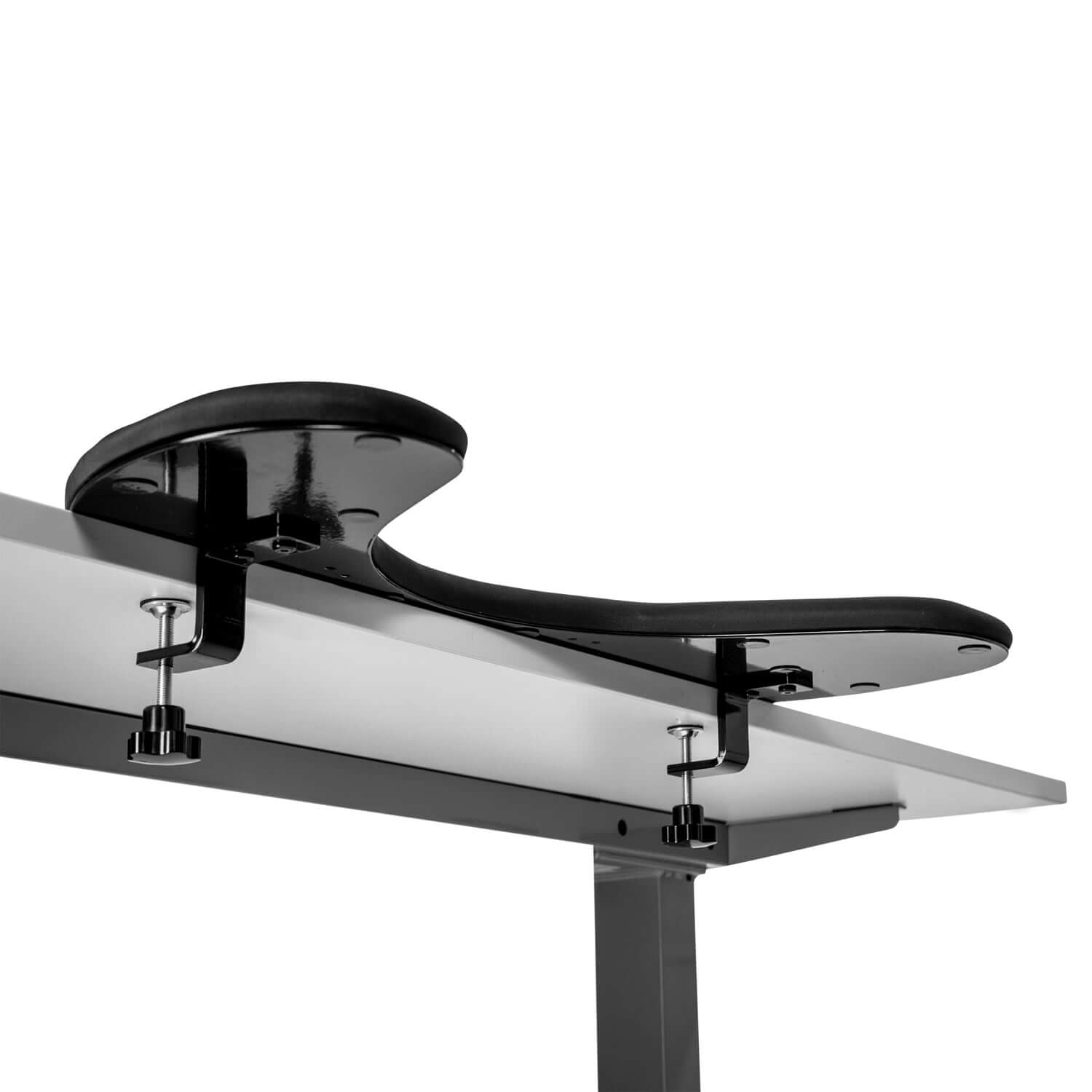 Ergonomic asymmetric arm support in artificial leather attached to desk edge for relieving shoulder and neck pain.