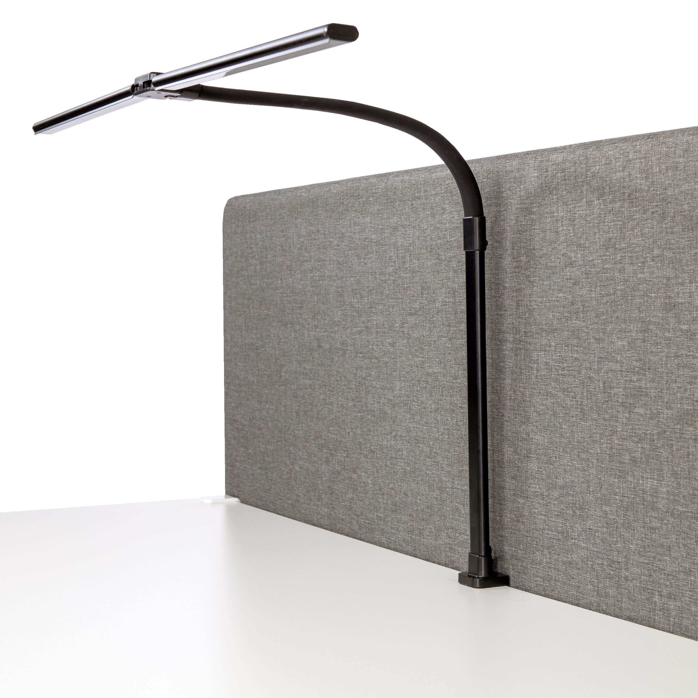 Black DUO LED desk lamp with dual adjustable light heads on a modern office workstation.