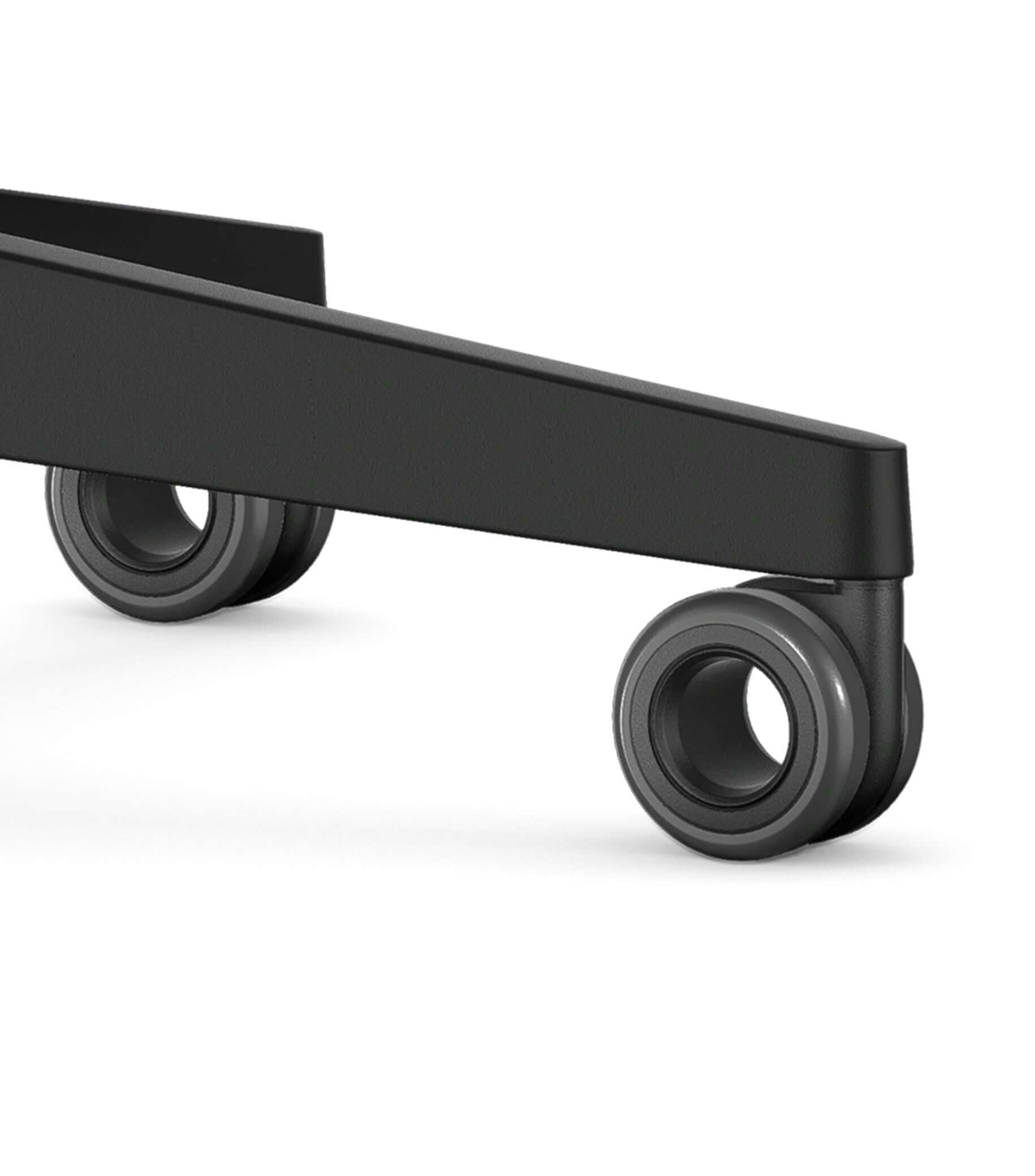 Black caster wheels of an office chair with Smart-Spring technology for enhanced mobility and ergonomic support.