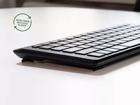 Compact Type Mini keyboard with ergonomic design made from recycled plastic on a white surface.