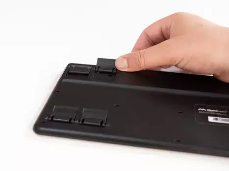 Adjusting the back stand of a Type Mini keyboard for ergonomic use and portability