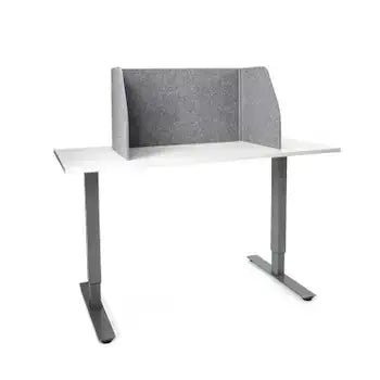 Foldable grey table screen with sound-absorbing fabric on a desk, ideal for creating productive work environments.