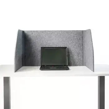 Grey foldable table screen with laptop, sound-absorbing fabric, enhances productivity, eliminates visual disturbances on white desk.