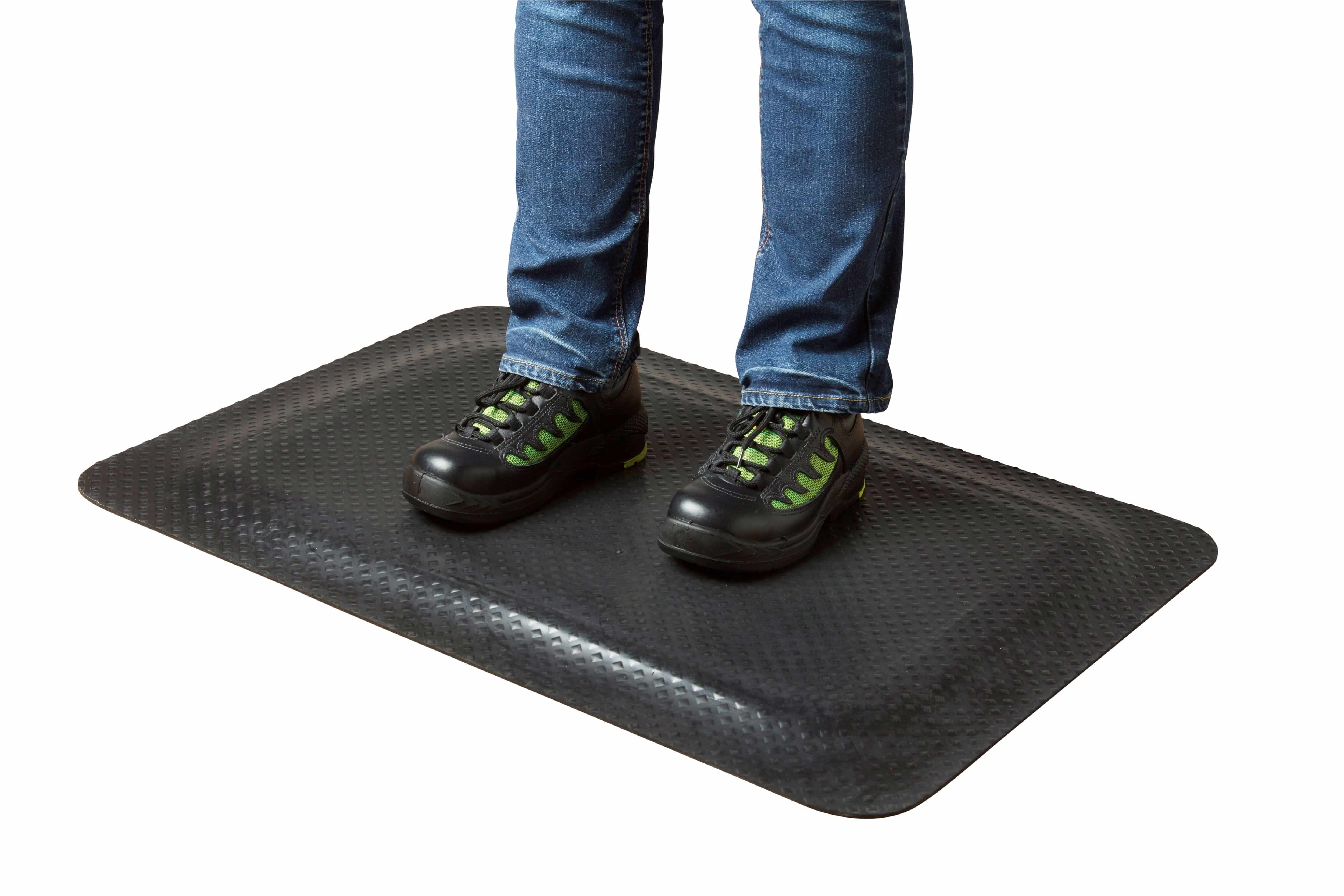 Industrial standing mat in use, showing comfort and strain reduction for workers in dry and damp environments.