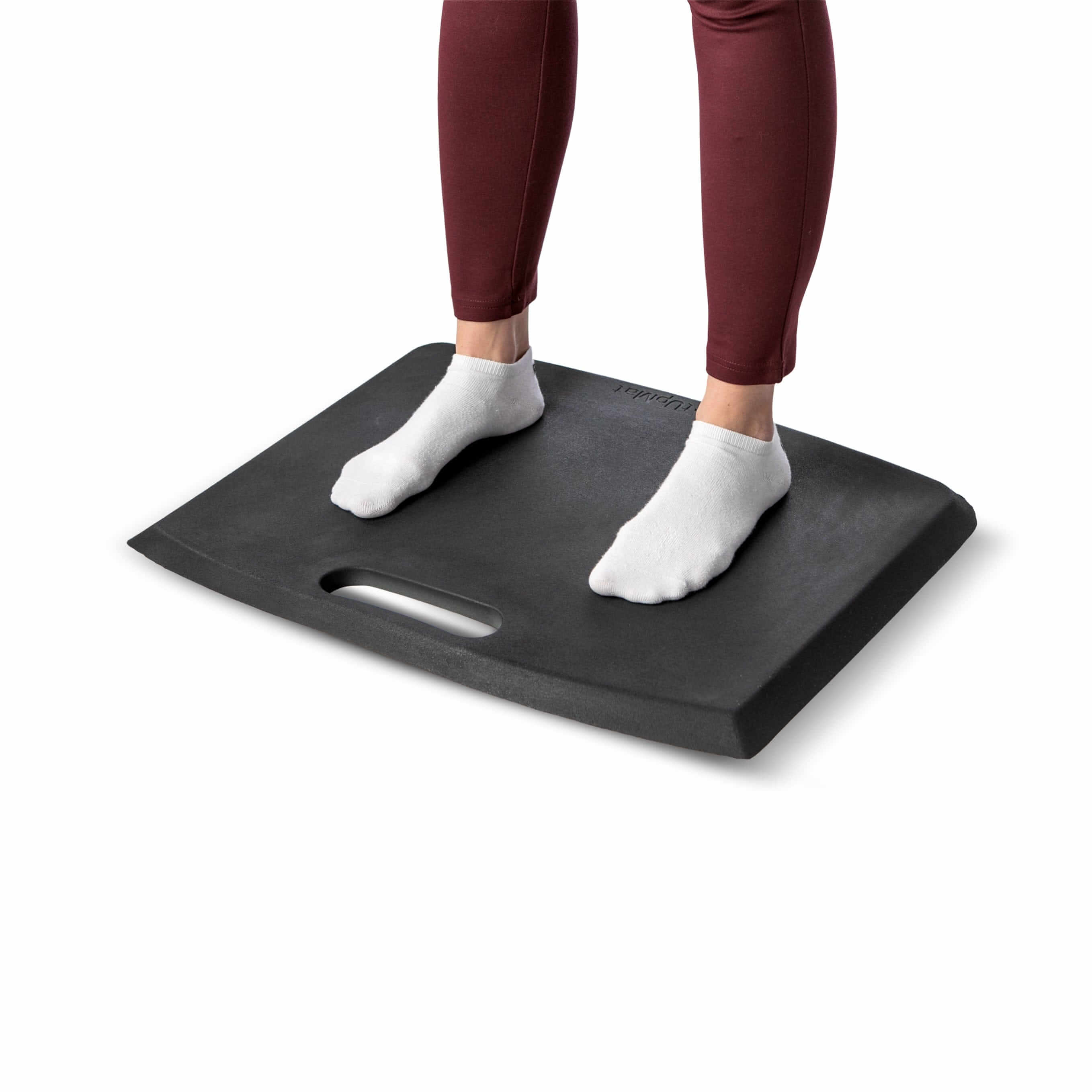 Person standing on grey GetUpMat workstation mat with carrying handle, showcasing ergonomic design and comfort for various workplaces.