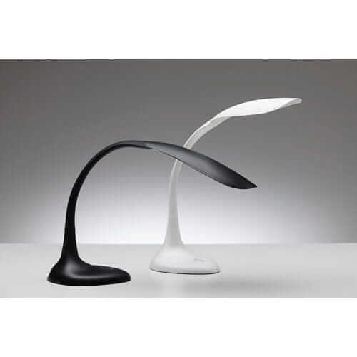 Sleek black and white Flexlite LED desk lamps with adjustable arms, showcasing modern design and ergonomic functionality.