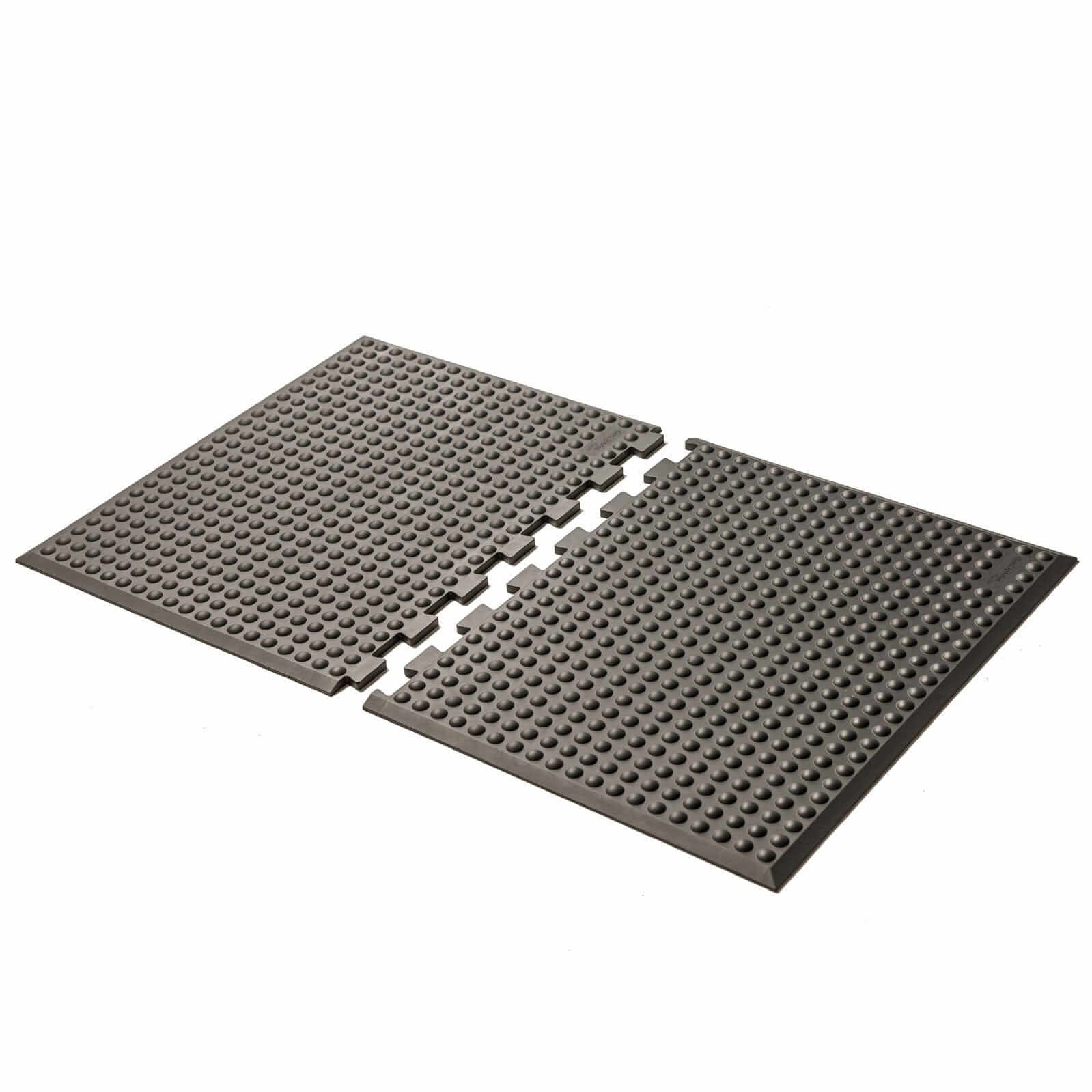 Grey GetUpMat Puzzle workstation standing mat with interlocking pieces for ergonomic comfort.